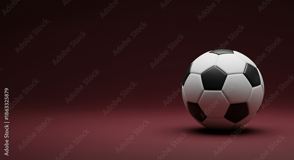 Naklejka premium A soccer ball on a maroon colored surface and background