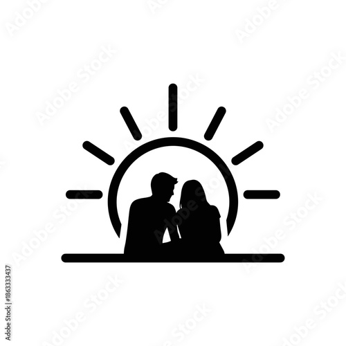 Silhouette of couple sitting together in front of sunrise background  