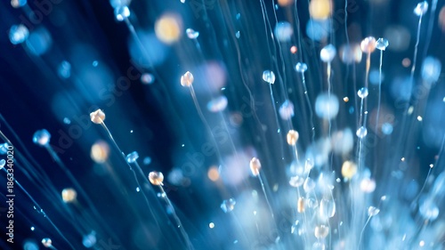 Abstract blue light trails and fiber optic style bokeh background with soft glow