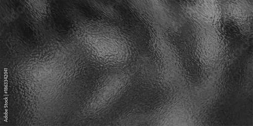 A dark and textured black leather background features a rough natural skin pattern and vintage grunge surface, creating a macro material backdrop perfect for a high-fashion fabric design wallpaper