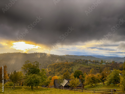 Sunny Autumn Carpathians with Puffy White During The Sunset