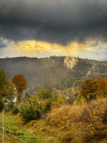 Sunny Autumn Carpathians with Puffy White During The Sunset