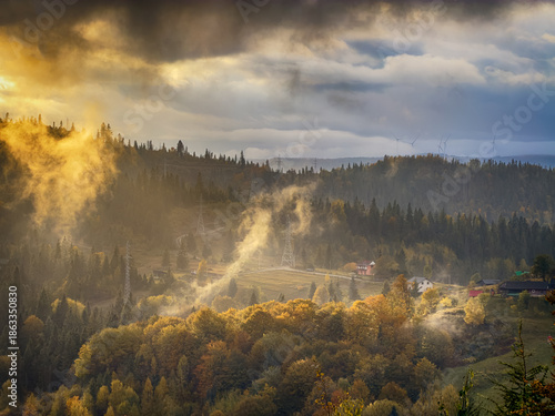 Sunny Autumn Carpathians with Puffy White During The Sunset