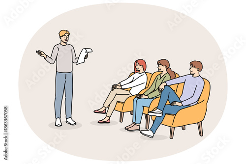 Poetry evening with man reading own poems, for positive listeners sitting in armchairs. Poetry party with students on university campus for involvement in development of creative potential.