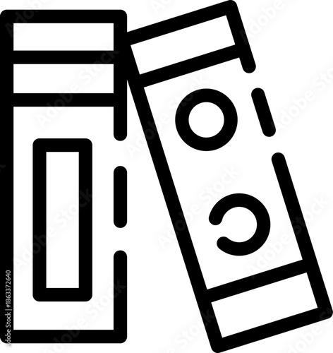 Two books standing upright and leaning against each other.