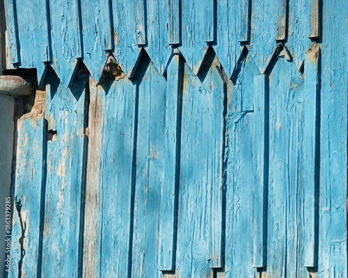 Rustic Faded Blue Wooden Siding Background with Traditional Decorative Carving