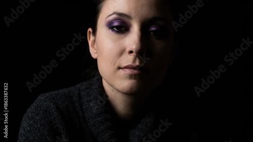 Mysterious Womans Gaze in Low Light, Intense and Captivating.