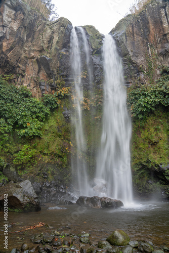 Salto da Farinha waterfall, water crashing with great impact against the rocks, São Miguel Island in the Azores archipelago, Portugal.