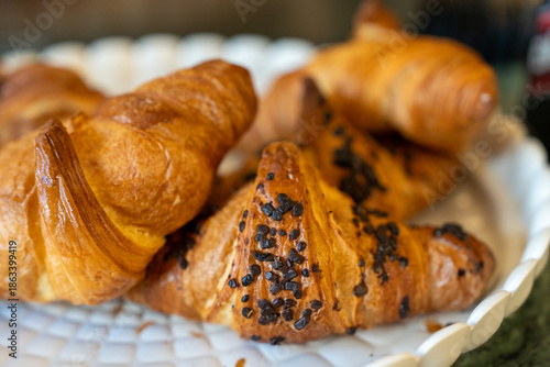 Assorted cornetti displayed for breakfast with crispy layers and gourmet presentation © jovannig