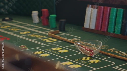 Close Up Of Empty Casino Craps Table With Chips And Dice