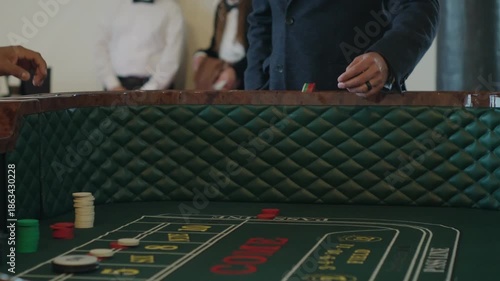 Casino Player Throwing Dice in Craps Game