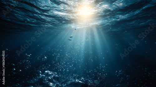 Dramatic Deep Ocean View Looking Up at Intense Sun Rays and Rising Air Bubbles
