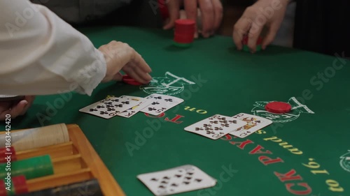 Close-Up of Hands Playing Blackjack in Casino