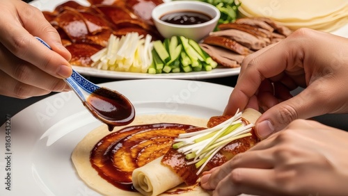 Wallpaper Mural Hands preparing a dish with sauce and vegetables on a table with other food Torontodigital.ca