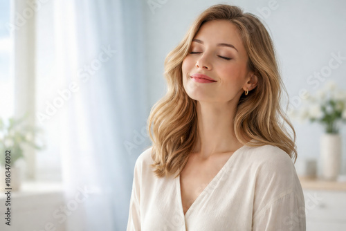 Peaceful mind and emotional balance, relaxed woman with soft smile and closed eyes, bright airy interior, neutral colors, realistic wellbeing concept for calm, mindfulness, recovery, self care