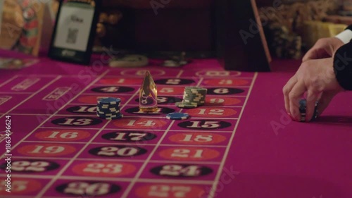 close up of Dealers Hands on Roulette Table Before Wheel Spin