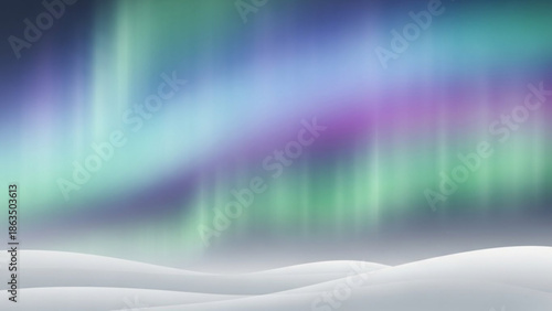 Aurora borealis northern lights display over snowy landscape with vibrant green purple blue