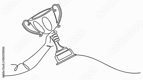 Hand proudly lifts a golden trophy in celebration of achievement and victory.