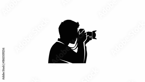 Silhouette of a photographer holding a camera and taking a picture.