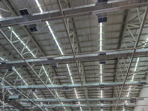 Wallpaper Mural Industrial warehouse ceiling structure with lighting and ventilation system, featuring modern architecture and functional design. Torontodigital.ca