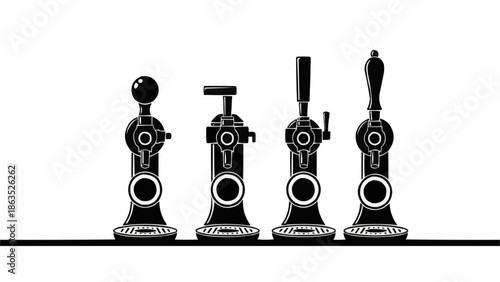Four vintage beer taps lined up in a row.