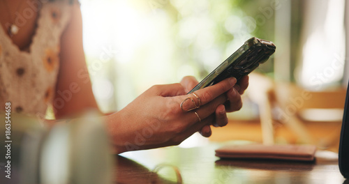 Foto Woman, hands and mobile and cafe for social media, networking and review restaurant online