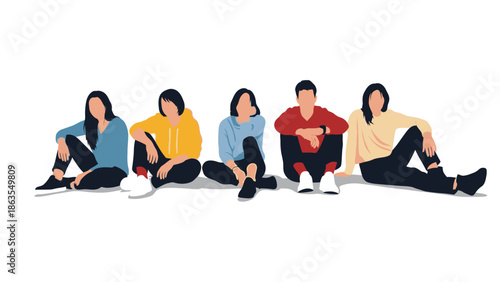 A group of five young adults are sitting on the floor in a line, dressed in casual clothing.