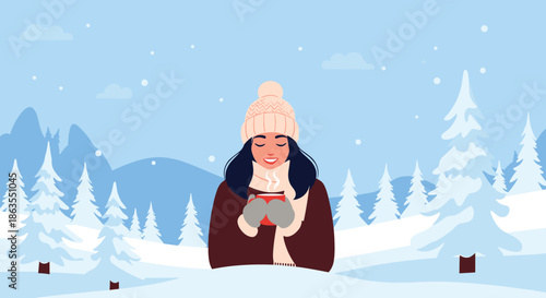 Smiling young woman wearing a winter hat and scarf happily holding a warm cup of coffee in a snowy forest.