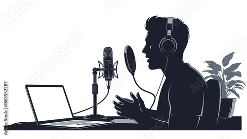 Silhouette of a person wearing headphones and speaking into a microphone at a desk with a laptop and a plant.