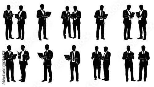 Silhouettes of businessmen in suits interacting with laptops and documents, showcasing professional collaboration and technology use.