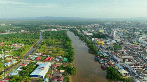Aerial View of River and Urban Landscape in a Growing Tropical Town