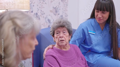 Wallpaper Mural Caregiver comforting senior woman in nursing home Torontodigital.ca