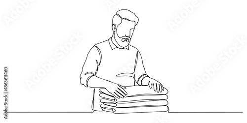 Continuous one line drawing of a man folding clothes, representing organization and neatness, line art style vector illustration.