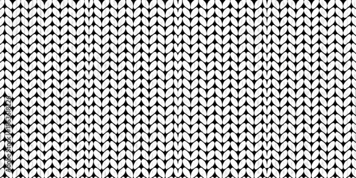 Close up of a black and white textured knit fabric pattern
