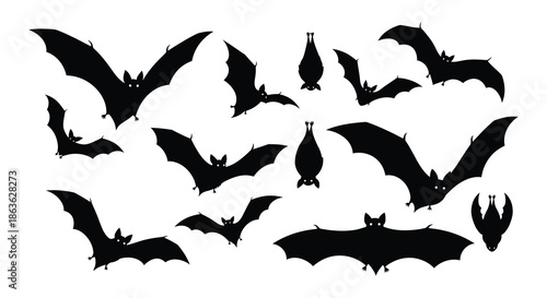 A collection of black bat silhouettes in various flying positions