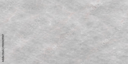 A fresh winter texture features a clean gray wall and window surface covered in natural frost and crystal snowflake patterns for an abstract cold weather background