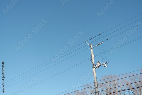 冬の快晴の空に電信柱と送電線 / Clear Winter Sky with Utility Pole and Power Lines