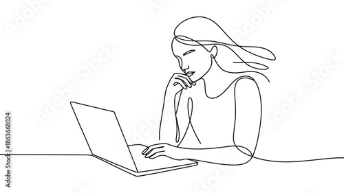 A focused woman with flowing hair intently works on her laptop computer with a thoughtful expression