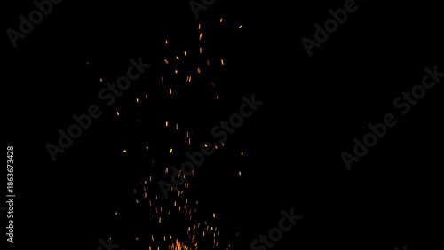 sparks and embers from campfire flying over black background
