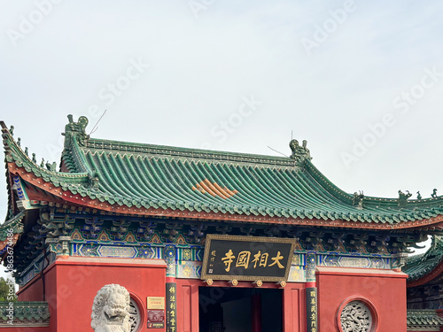 Fotografie Traditional Temple Roofline Under Clear Sky