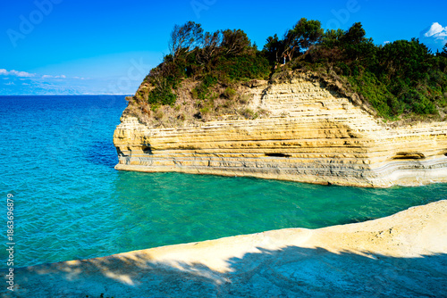 Famous tourist spot Canal D'Amour on island Corfu in Greece with turquoise water and beautiful rock formations.