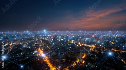Wallpaper Mural City Lights: Aerial shot of city with interconnected lights, the city sparkles beneath the twilight sky, an abstract representation of interconnected network and modern metropolis.  Torontodigital.ca