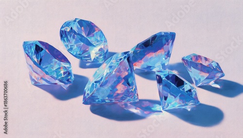 Close-up of several iridescent faceted gems arranged on a smooth, white surface