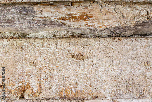 Detailed close up of rustic wooden planks with natural grain, rough texture, scratches, and weathered surface. Perfect background for design projects, vintage decor, carpentry, and creative artwork.