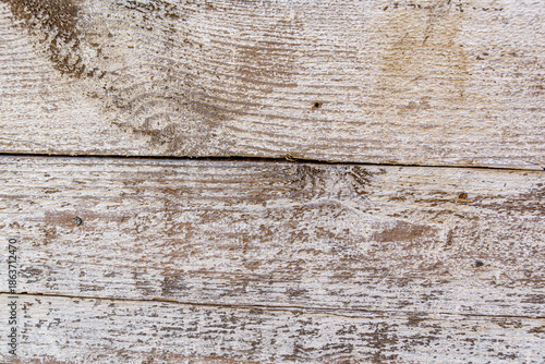 Detailed close up of rustic wooden planks with natural grain, rough texture, scratches, and weathered surface. Perfect background for design projects, vintage decor, carpentry, and creative artwork.