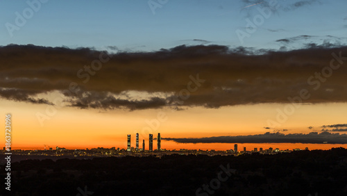 Sunrise views of the Madrid skyline through the morning mist