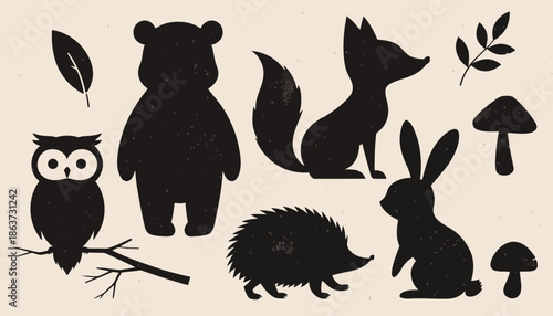 Woodland creatures silhouettes with leaves and mushrooms
