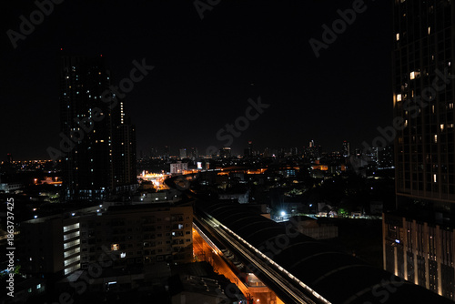 A city at night with a bridge in the middle