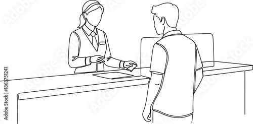 Businessman paying at a reception desk