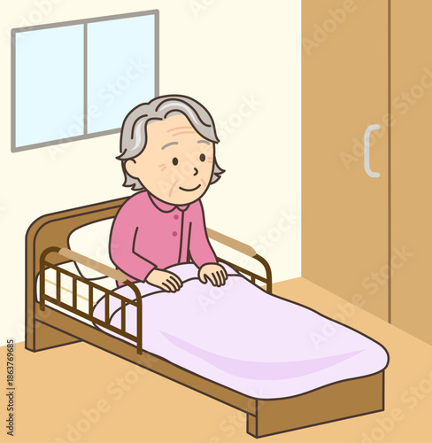 介護ベッド上で起きあがっているおばあさん